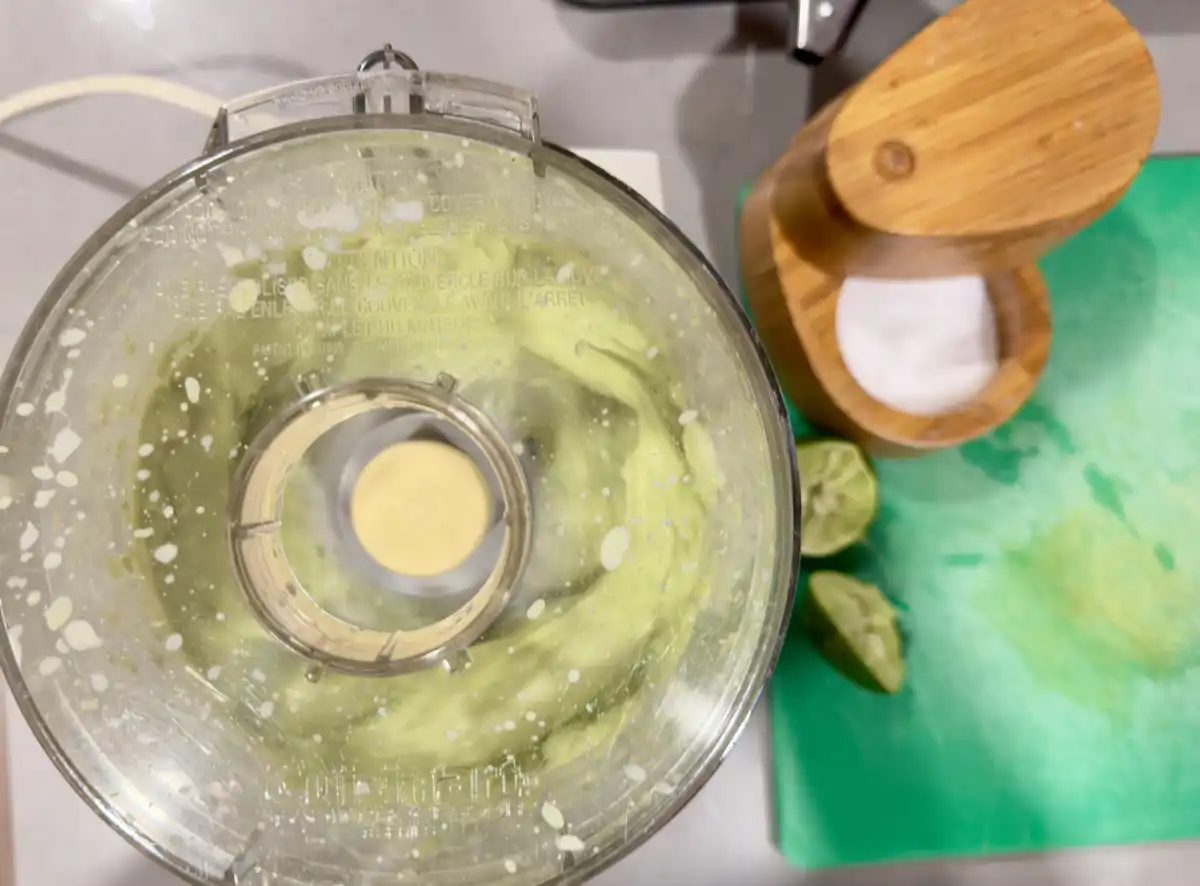 food processor mixing avocado sauce